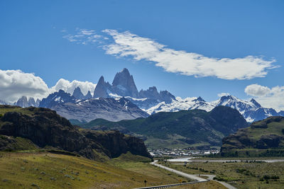 Scenic view of mountains against cloudy sky