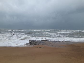Scenic view of beach against sky