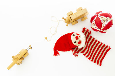 High angle view of red toys against white background