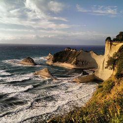 Scenic view of sea against cloudy sky