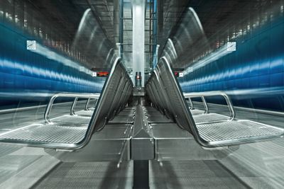 Long exposure of seats at subway station