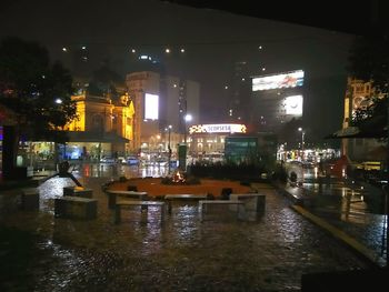 Reflection of illuminated buildings in water at night