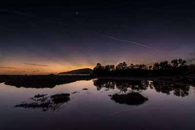 Sunset over calm lake