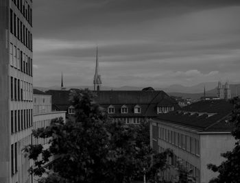Buildings in city against sky
