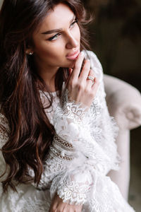 Beautiful young woman looking away