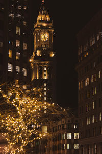 Low angle view of illuminated buildings at night