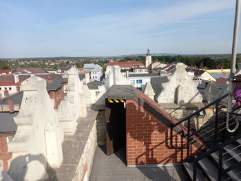 Buildings in town against sky