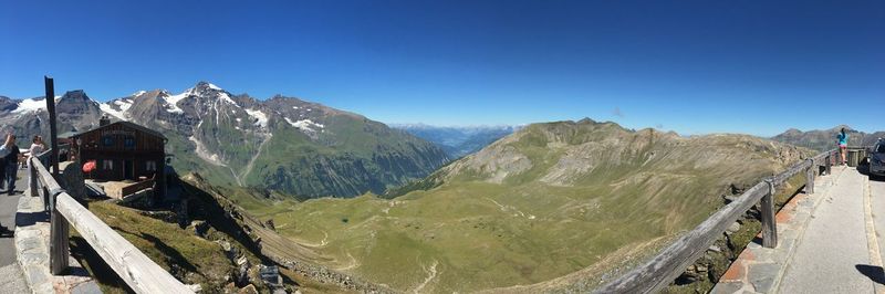 Panoramic view of mountains against clear blue sky