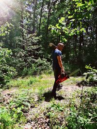 Full length of man walking in forest