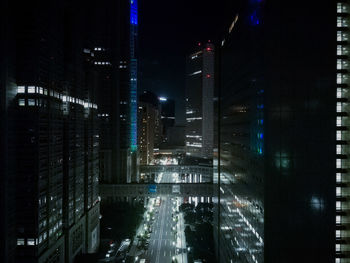 Illuminated modern buildings in city at night