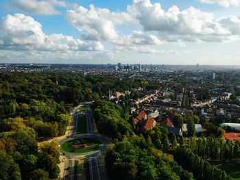 High angle view of trees and buildings against sky