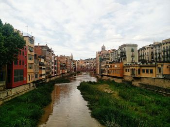 Houses in city against sky