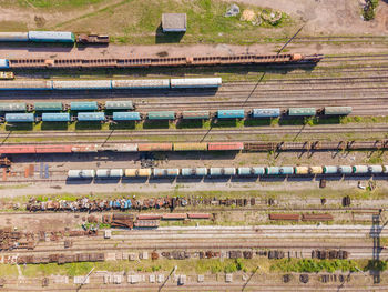 Lots of old railway tracks, trains at the old station, top view.