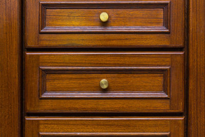 Close-up of balls on wooden door