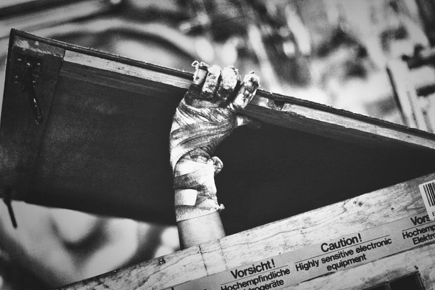 low angle view, text, communication, western script, close-up, focus on foreground, day, no people, outdoors, metal, old, built structure, wood - material, art and craft, architecture, selective focus, art, metallic, non-western script, rusty