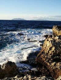 Scenic view of sea against clear sky