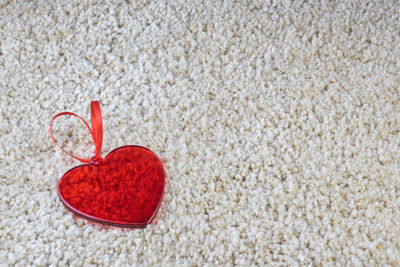 High angle view of heart shape on rug