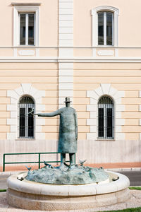 View of fountain against building