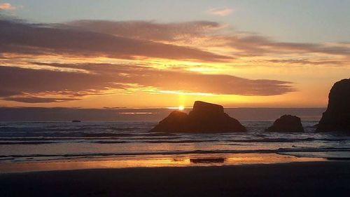 View of beach at sunset