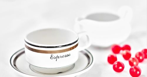 Close-up of coffee cup over white background