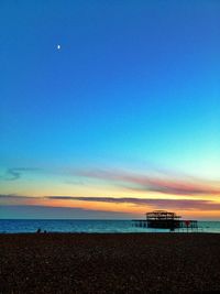 Scenic view of calm sea at sunset