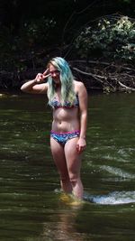 Full length of young woman in bikini