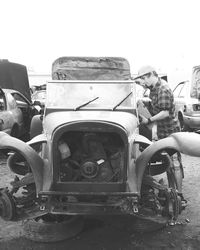 Close-up of vintage car against sky