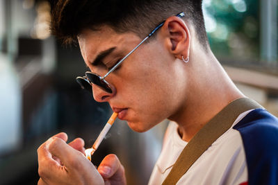 Close-up of man smoking cigarette