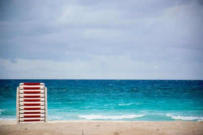 Scenic view of sea over beach against sky