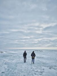 Scenic view of sea against cloudy sky