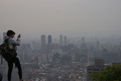 Woman looking at cityscape