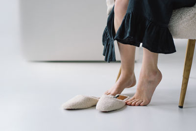 Low section of woman standing on floor