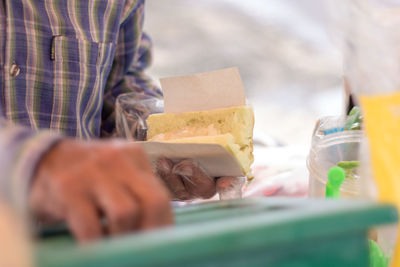 Midsection of man preparing food