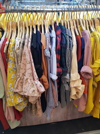 Clothes hanging on rack for sale