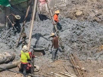 High angle view of man working on rock