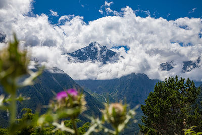 View of huge mountains with waterfalls and beautiful clouds in north ossetia