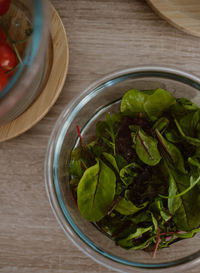 High angle view of leaves in bowl on table