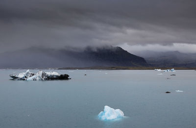 Scenic view of sea against sky during winter