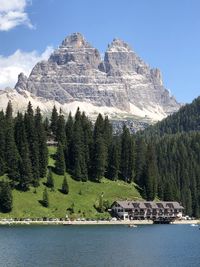 Scenic view of lake and mountains against sky