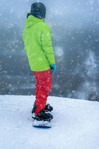 Rear view of man in snow