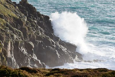 Sea waves splashing on rocks