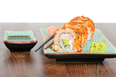 Close-up of sushi served on table