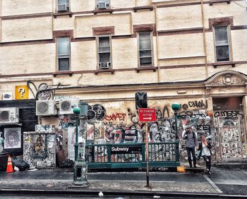 People on street against building