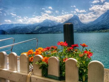 Scenic view of lake and mountains against sky