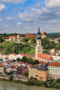 Buildings in town against sky