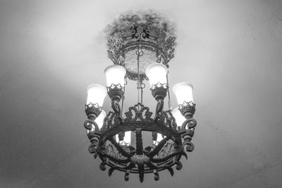 Low angle view of illuminated chandelier