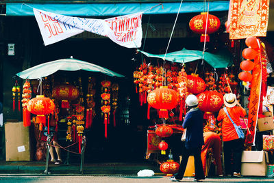 People at market stall in city