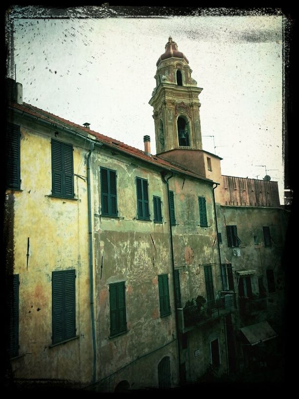 building exterior, architecture, transfer print, built structure, auto post production filter, low angle view, church, religion, sky, window, clear sky, building, day, old, no people, outdoors, city, residential structure