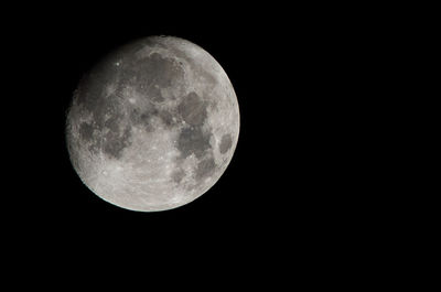 Low angle view of moon against sky at night