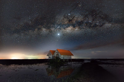 Scenic view of sea against sky at night